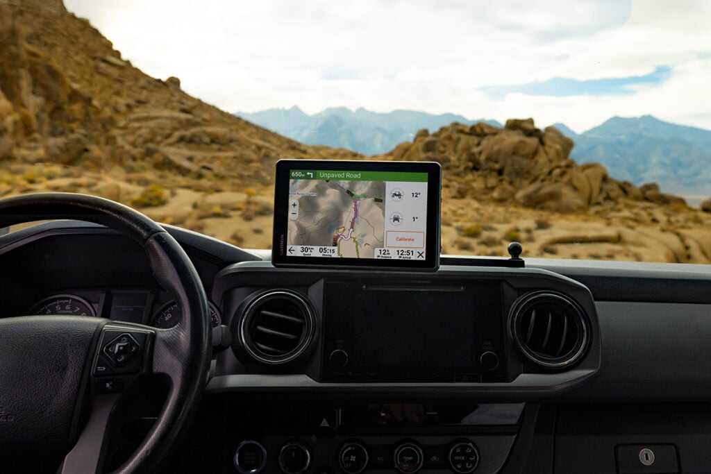 The Tread 2 GPS navigator is displayed on a vehicle's dashboard.